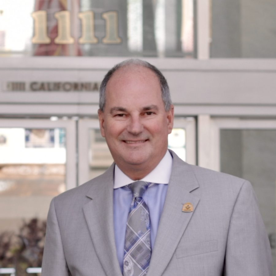 California Masonic Memorial Temple board chairman Mark Pressey poses in front of the Grand Lodge temple in San Francisco