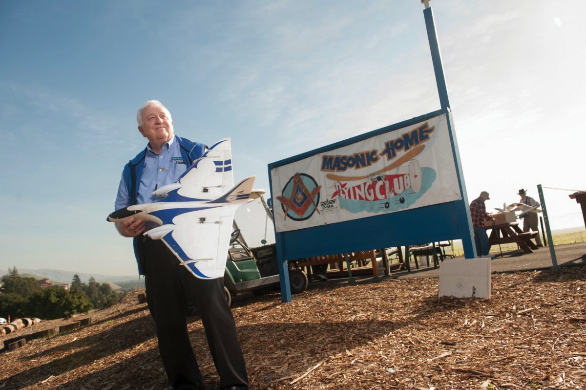 Masonic Homes resident Don Walden poses with his model airplane.